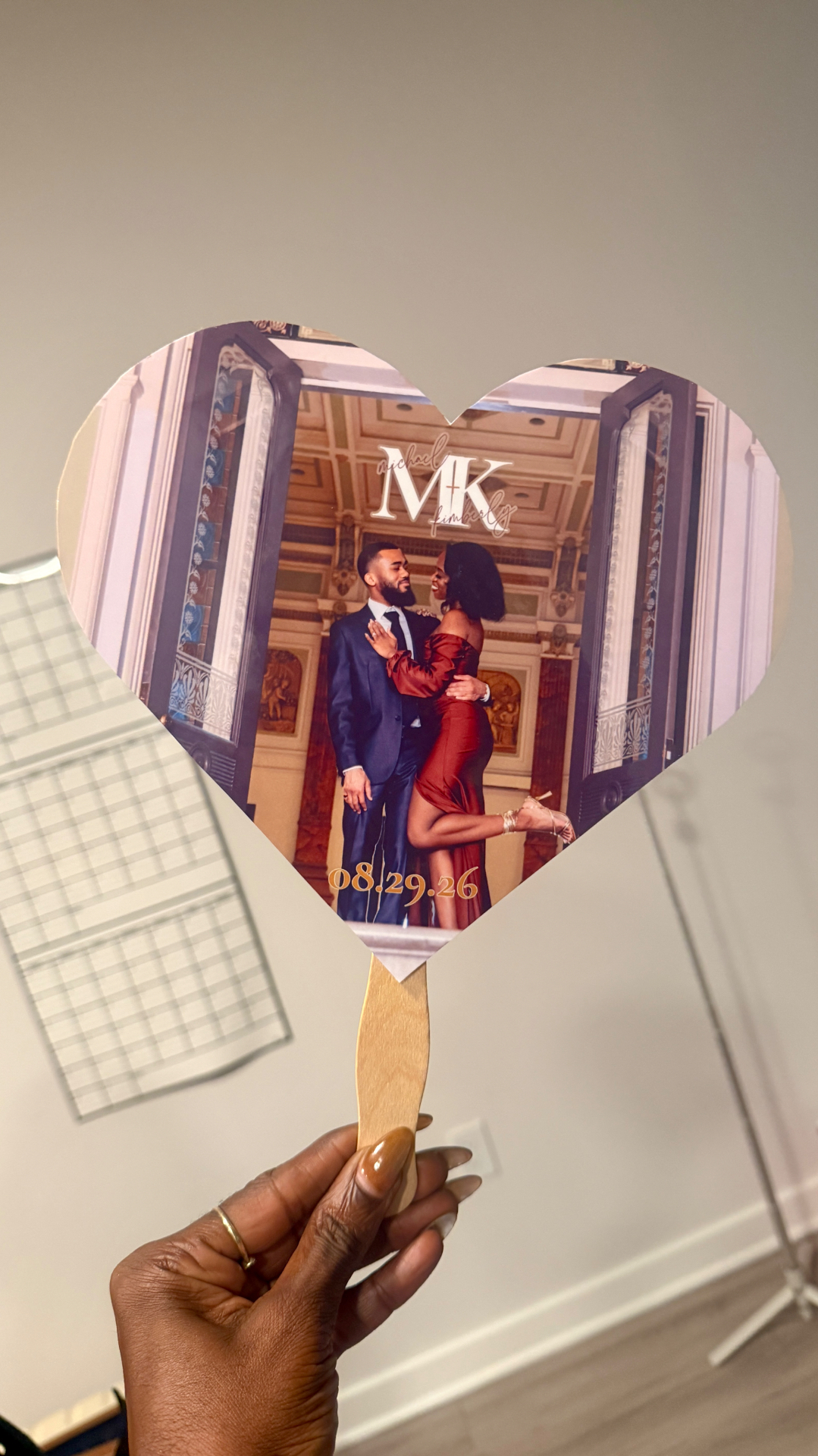 Heart-shaped wedding fan personalized with an engaged couple's photo and date