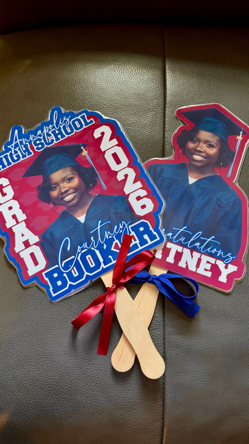 Custom graduation hand fans printed with a graduate's photo and school name