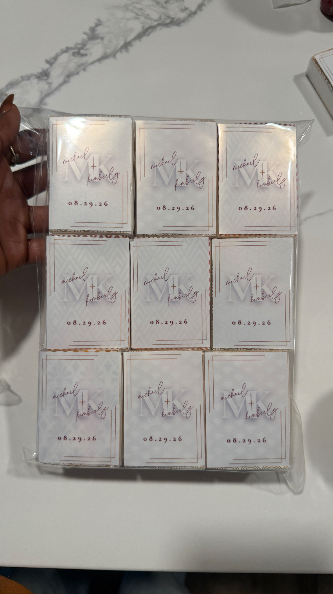 Custom mini tissue packs finished with monogrammed wedding stickers for Michael and Kimberly