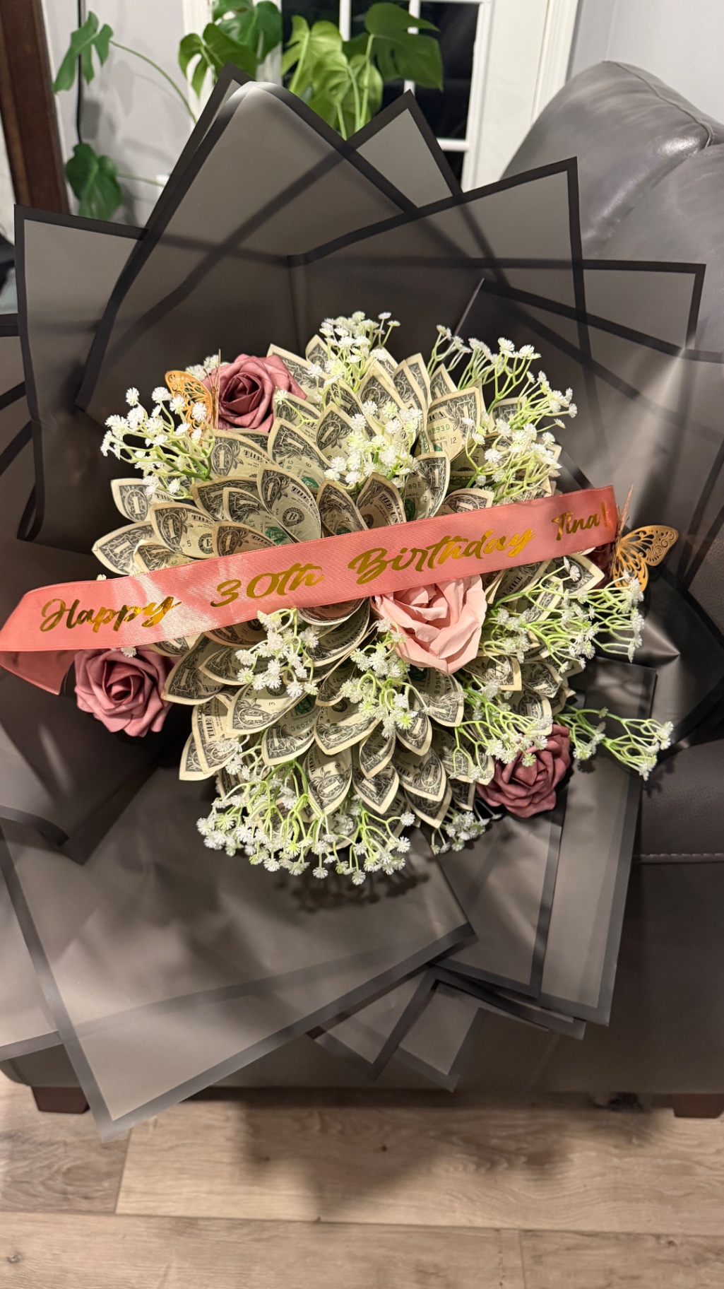 Money bouquet with roses and a personalized birthday ribbon